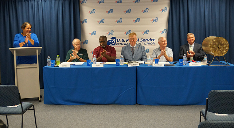Annual Meeting Board Sitting At Table